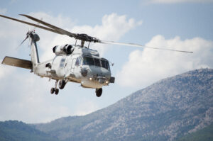 Black hawk helicopter rescue team.Close up,nose down low flight maneuvering
